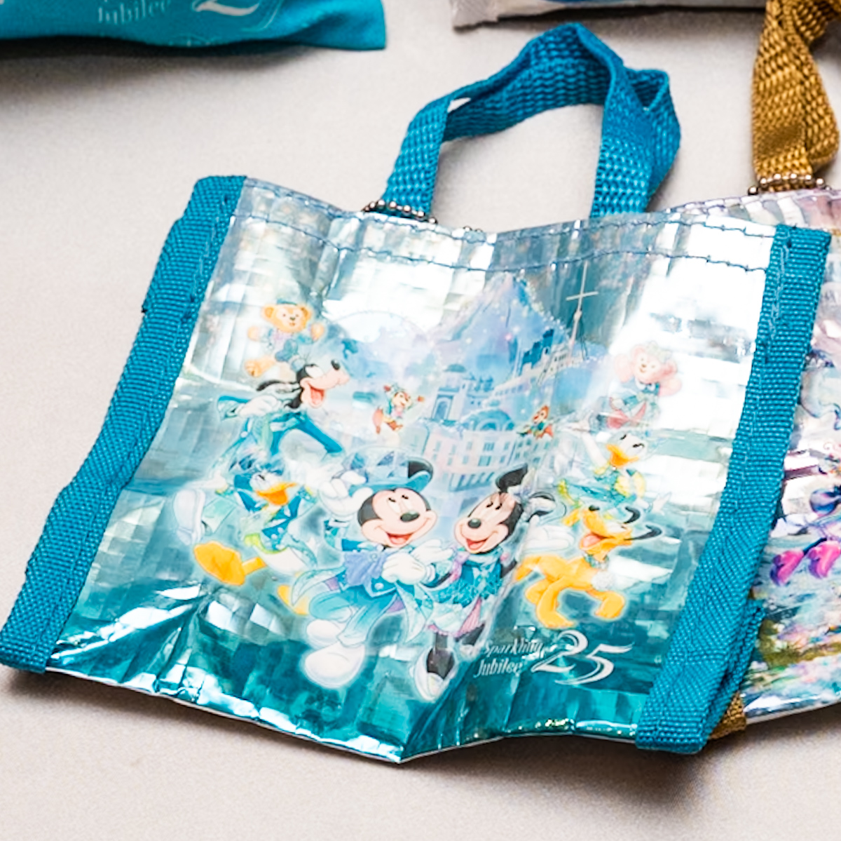 東京ディズニーシー25周年”スパークリング・ジュビリー”カプセルトイ（ショッピングバッグデザインの小物入れ）25周年